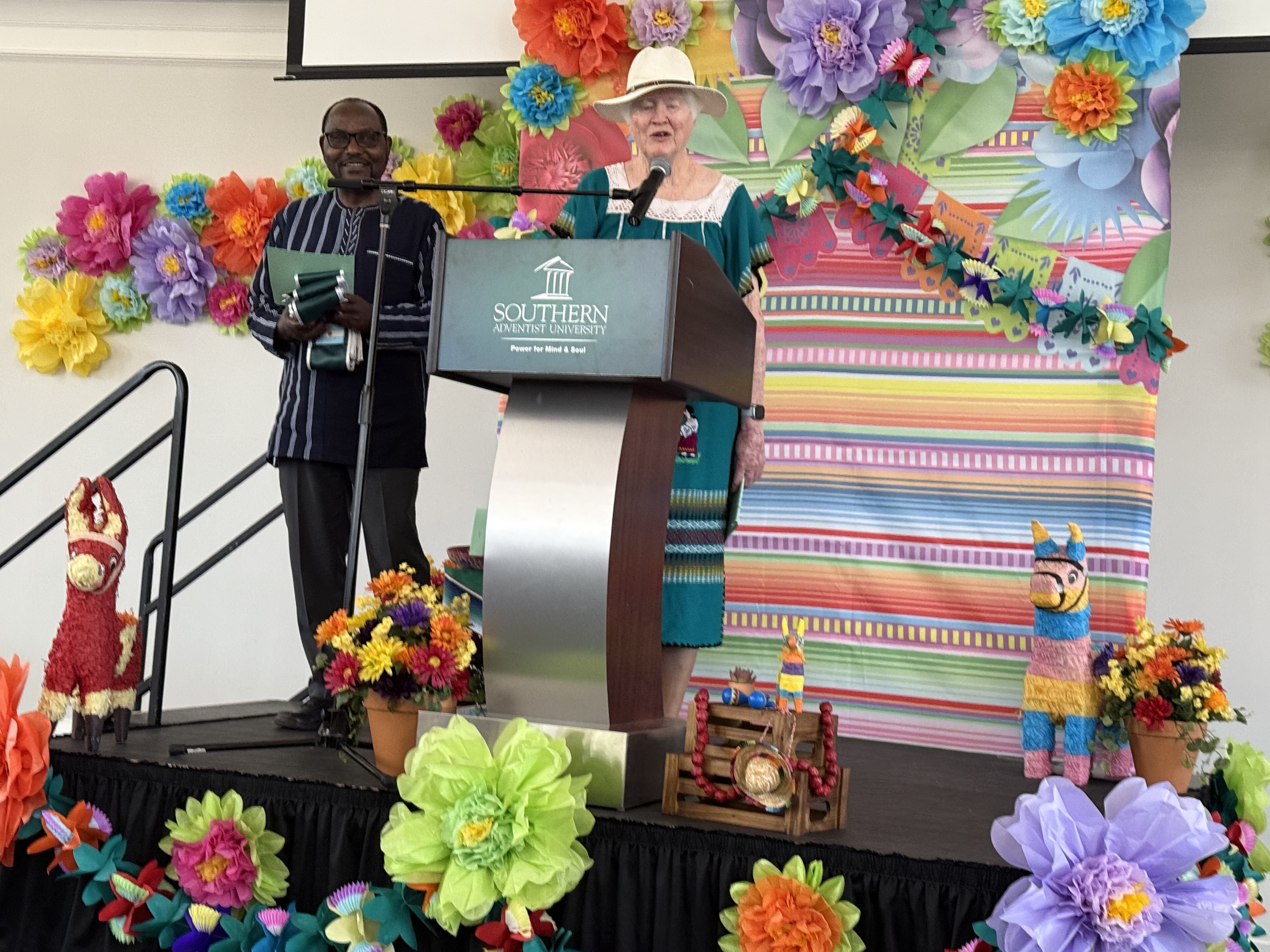 Dr Royo giving a speech with Dr. Pierre