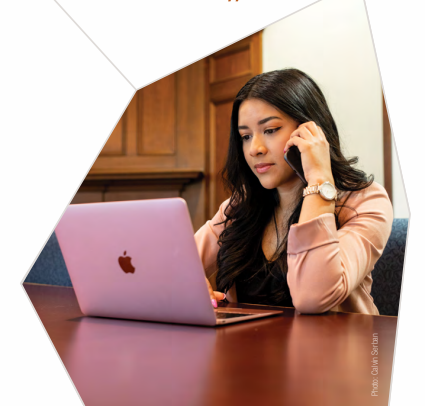 BSW Student working at a laptop 