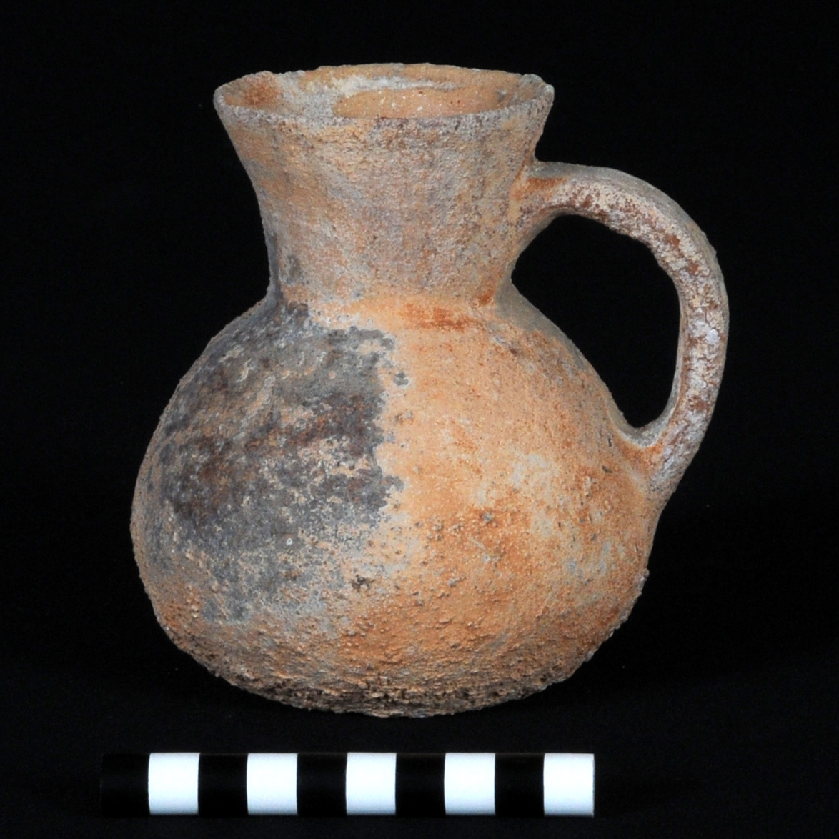an orange and grey flask pitcher