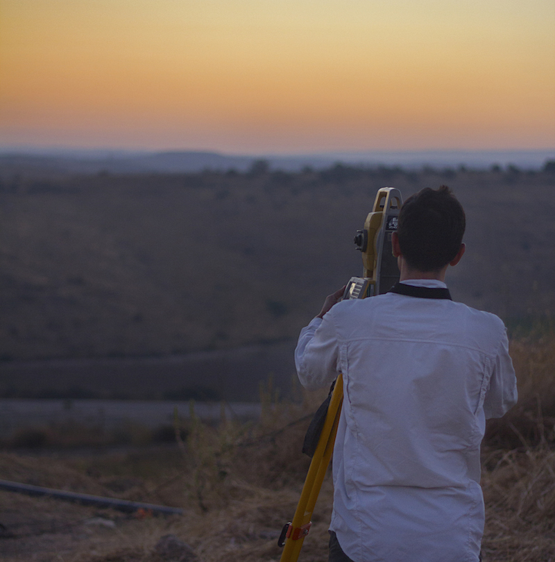 someone using a tool outside