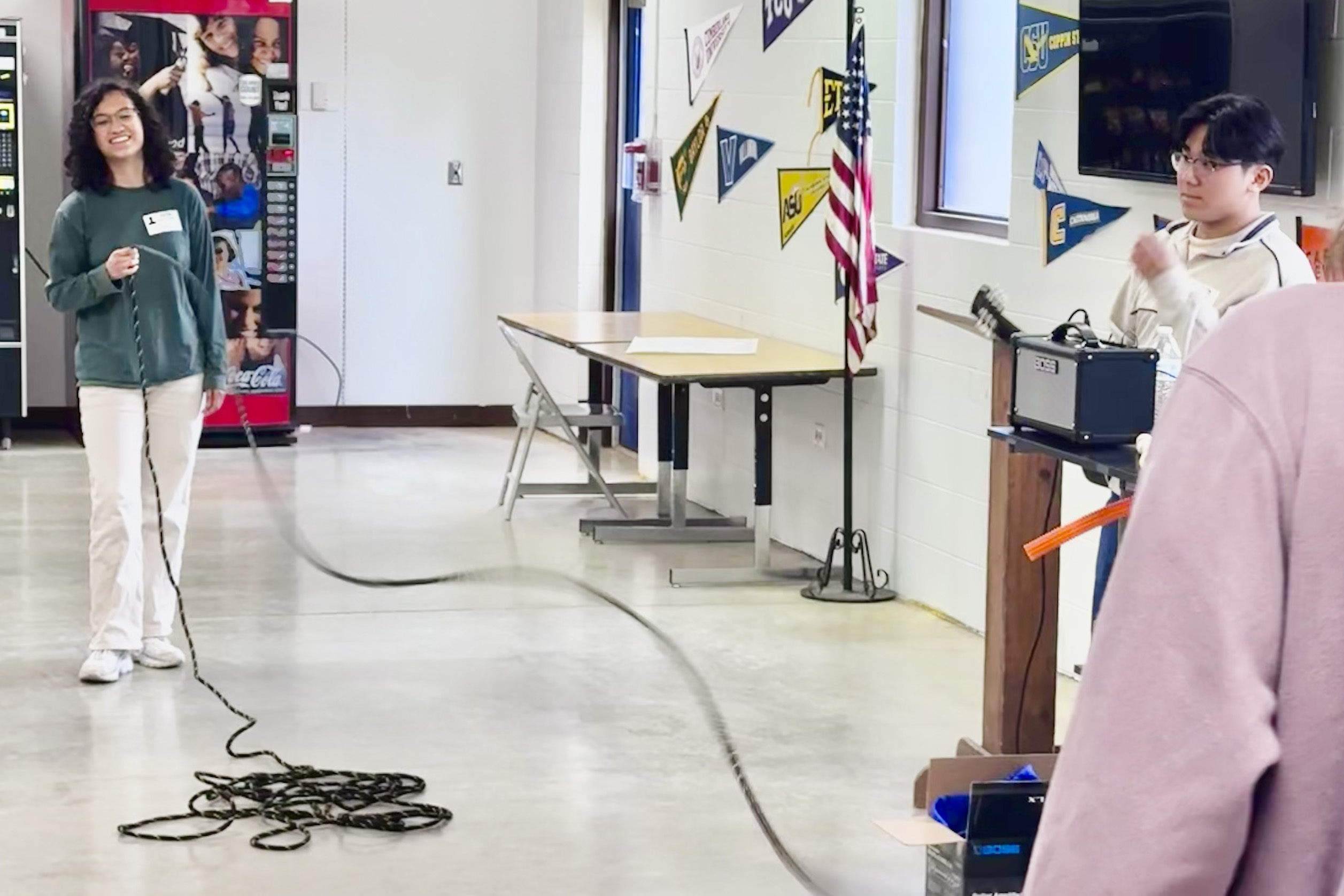 physics students teach quantum basics at a local school